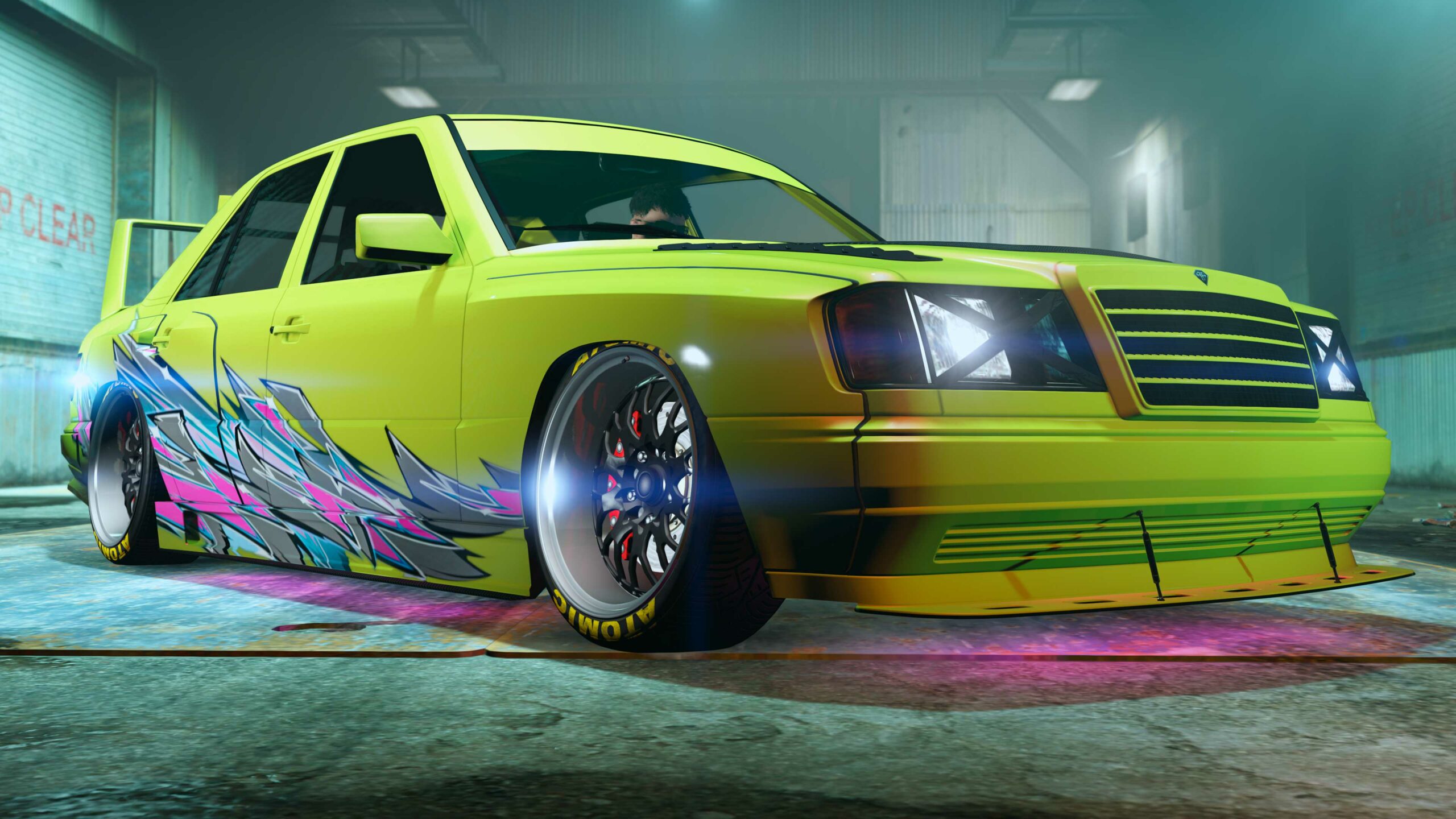 Um Benefactor Vorschlaghammer com pintura verde e estampa Respingos Drift com respingos nas cores rosa e cinza ao redor das rodas traseiras.